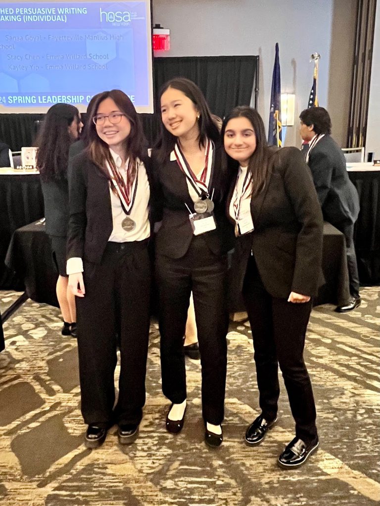 Sanaa Goyal (right) wins a bronze medal in Researched Persuasive Writing and Speaking.