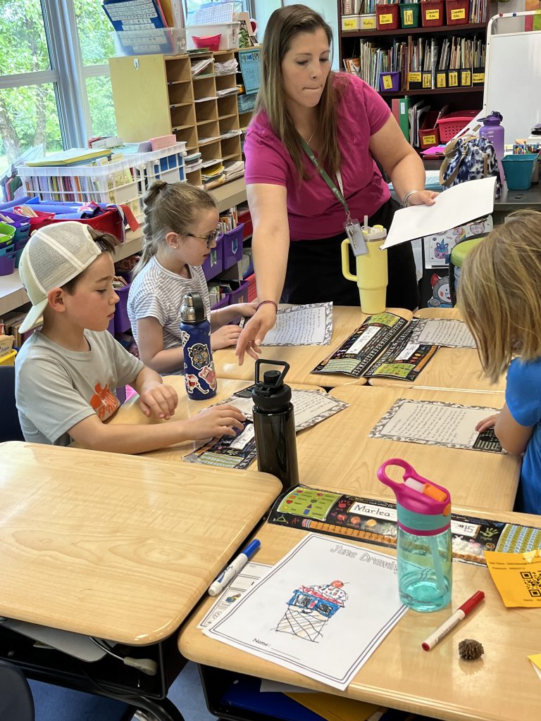 Mrs. Merritt's second grade class was awarded a plaque from Navy Reservist Jessica Serafin for their work in sending letters to military members overseas.