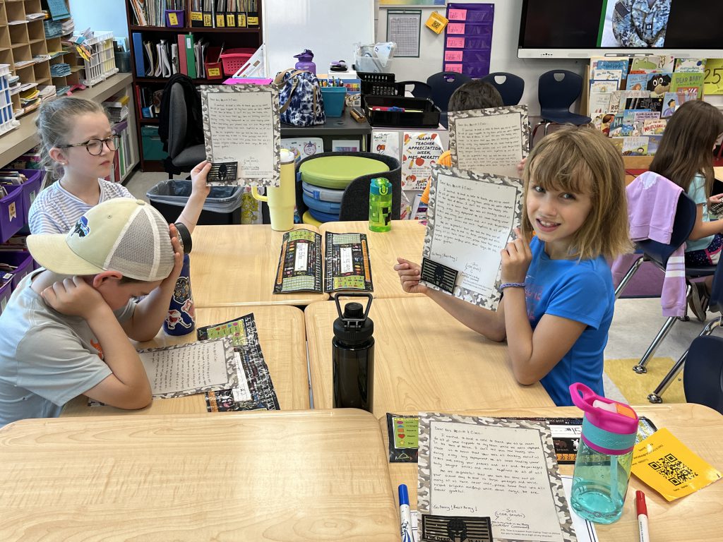 Mrs. Merritt's second grade class was awarded a plaque from Navy Reservist Jessica Serafin for their work in sending letters to military members overseas.