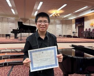 Yachen Ren celebrates his invitation to NYSSMA’s 26th Annual Young Composer Honors Concert.