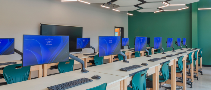 rows of computers inside a new modernized classroom