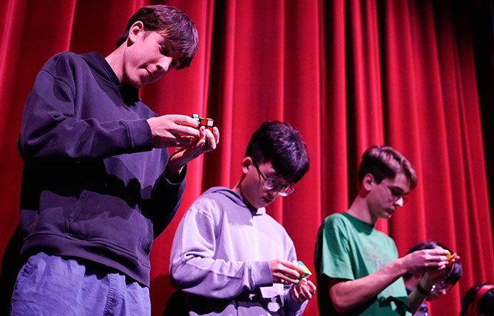 FMHS students race to complete Rubik's Cubes during Pi Day.